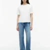 T-shirt com laço nas costas em materiais mistos T-shirt com laço nas costas em materiais mistos