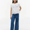 T-shirt infantil com laço à frente e conchas T-shirt infantil com laço à frente e conchas