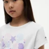 T-shirt infantil com laço à frente e conchas T-shirt infantil com laço à frente e conchas