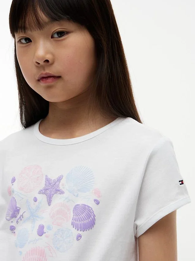 T-shirt infantil com laço à frente e conchas T-shirt infantil com laço à frente e conchas