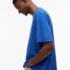 T-shirt Tommy Jeans com logótipo desgastado T-shirt Tommy Jeans com logótipo desgastado