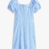 Vestido infantil de xadrez com mangas bufantes