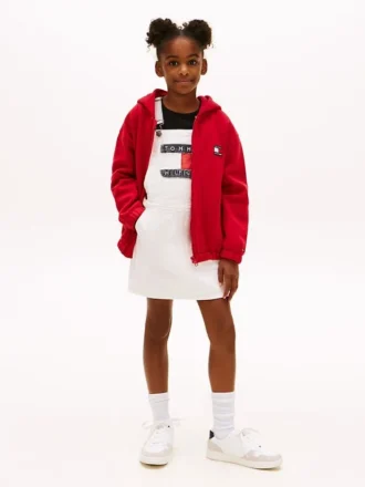 Vestido-macacão em Hilfiger Denim com emblema Hilfiger para criança Vestido-macacão em Hilfiger Denim com emblema Hilfiger para criança