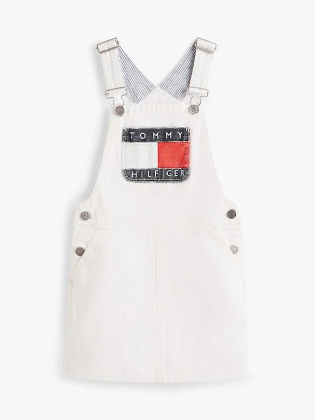 Vestido-macacão em Hilfiger Denim com emblema Hilfiger para criança Vestido-macacão em Hilfiger Denim com emblema Hilfiger para criança